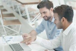 Two man working with a laptop