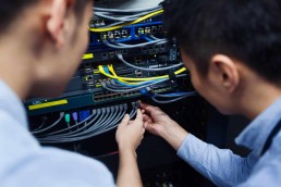 Two men working on a server